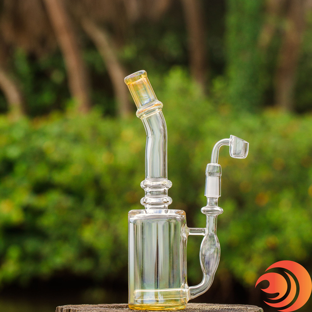 You can see the yellow tinted fluted mouthpiece and base on this glass dab rig from the best online smoke shop in Sarasota, FL