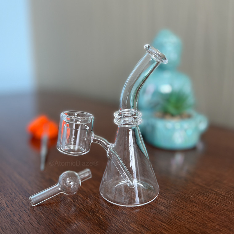 Get this mini quartz beaker dab rig with built in thermal banger and carb cap from Atomic Blaze Online Smoke Shop in Sarasota, FL.