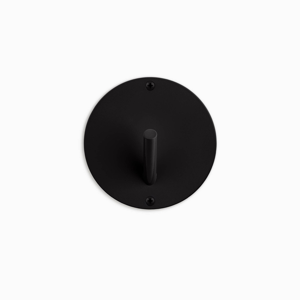 Matte black, solid steel single peg wall hook. Coat hook with round base. Radify and entryway, mudroom or bathroom with this wall hanger.