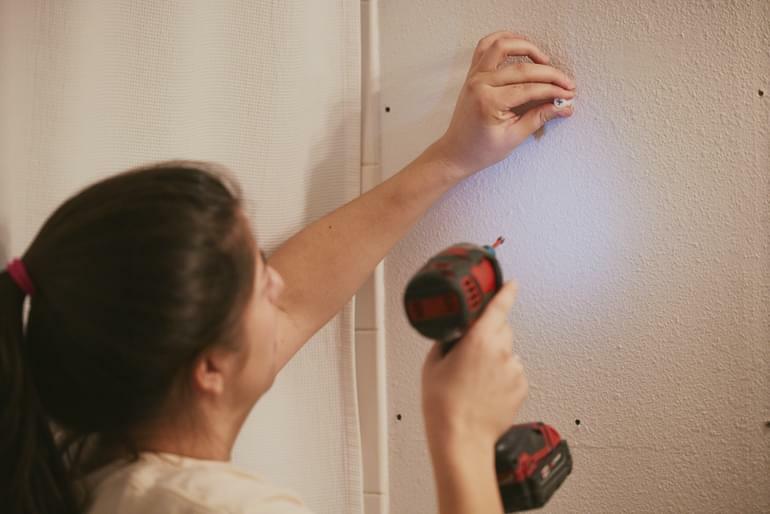 Drywall screws secure the included fasteners.