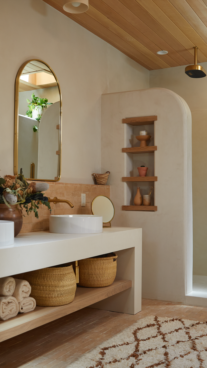 Open shelving creates a light, airy look in the bathroom.