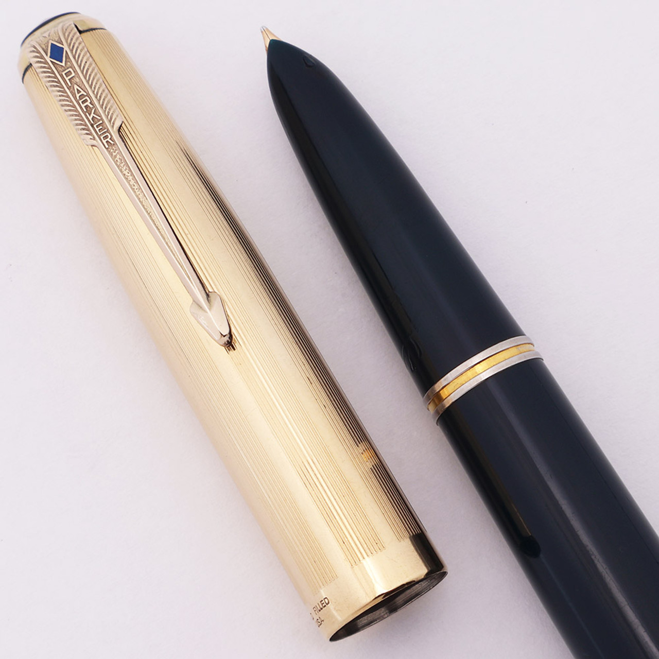 Parker 51 Vacumatic Fountain Pen (1946 ) - Cedar Blue, Gold Filled 9 Line Cap, Blue Diamond Clip, Medium-Fine Gold Nib (Excellent +, Restored) Parker 51 Vacumatic Fountain Pen (1946 ) - Cedar Blue, Gold Filled 9 Line Cap, Blue Diamond Clip, Medium-Fine Gold Nib (Excellent +, Restored)