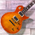 Excellent Condition preowned Vinatage AV1 Les Paul equipped with Wilkinson Humbuckers - Flame maple top in amber-burst