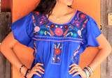 The Captivating Beauty of Hand-Embroidered Puebla Dresses: A Symbol of Mexican Tradition and Elegance