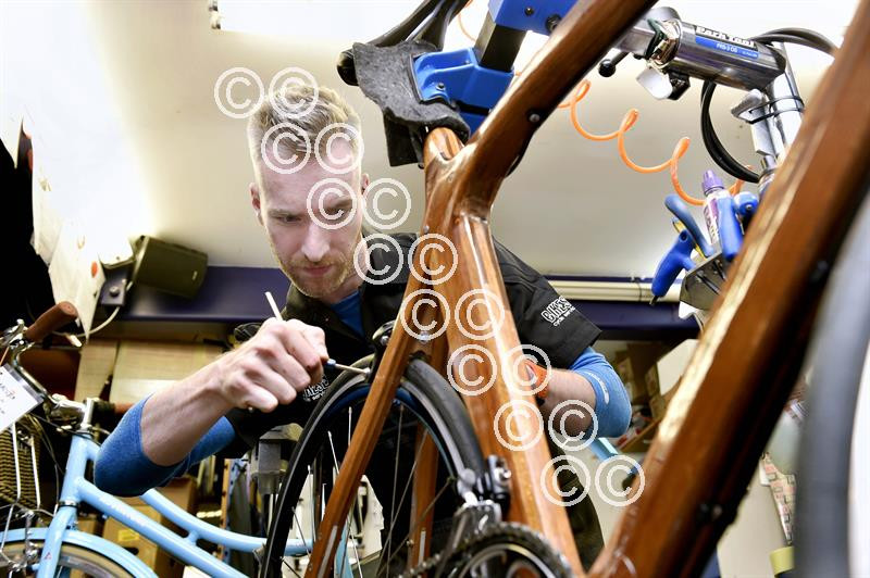 39981363-Levi Van Belzen partner at Bike cycle shop in Longtown, works  on the finishing touches to Richard Harris's wooden road He has