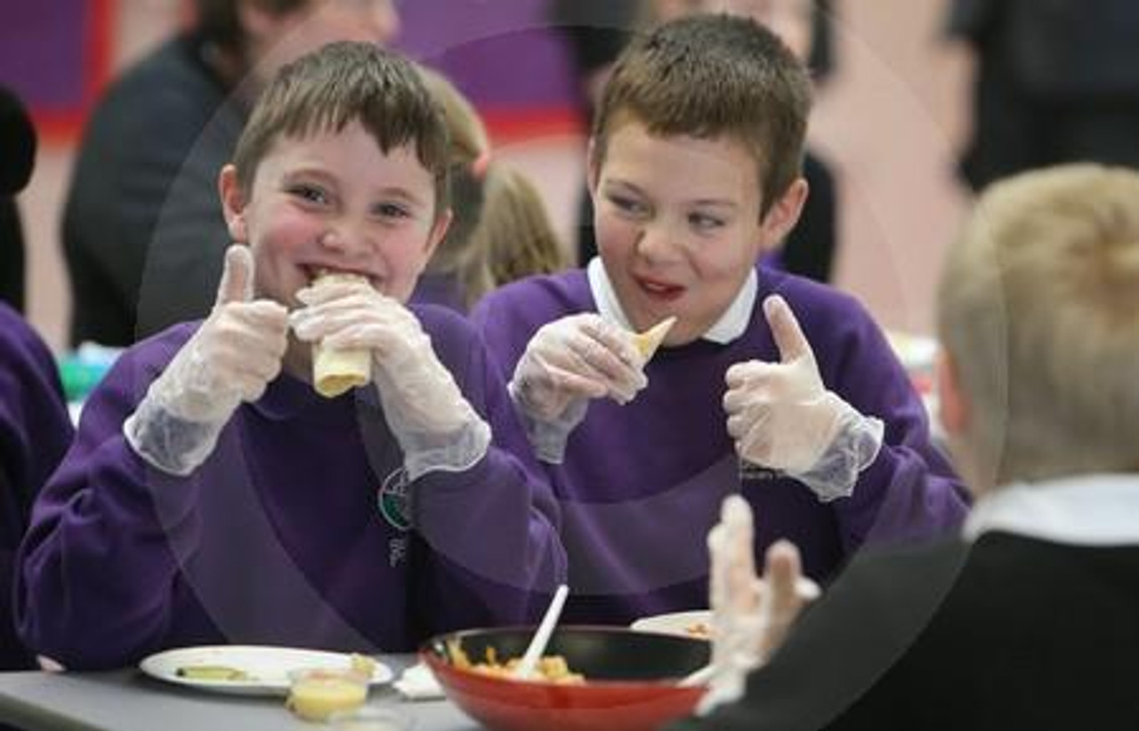 27122153 P4 pupils Brodie Gillan left and Aidan Blackie of Strathesk Primary in Penicuik enjoys a chicken tortilla wrap at the launch of the