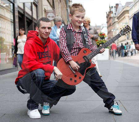 Kris Rocking 18080752-Busking feature for ET. Pictured is eight year old rocker Kris ...
