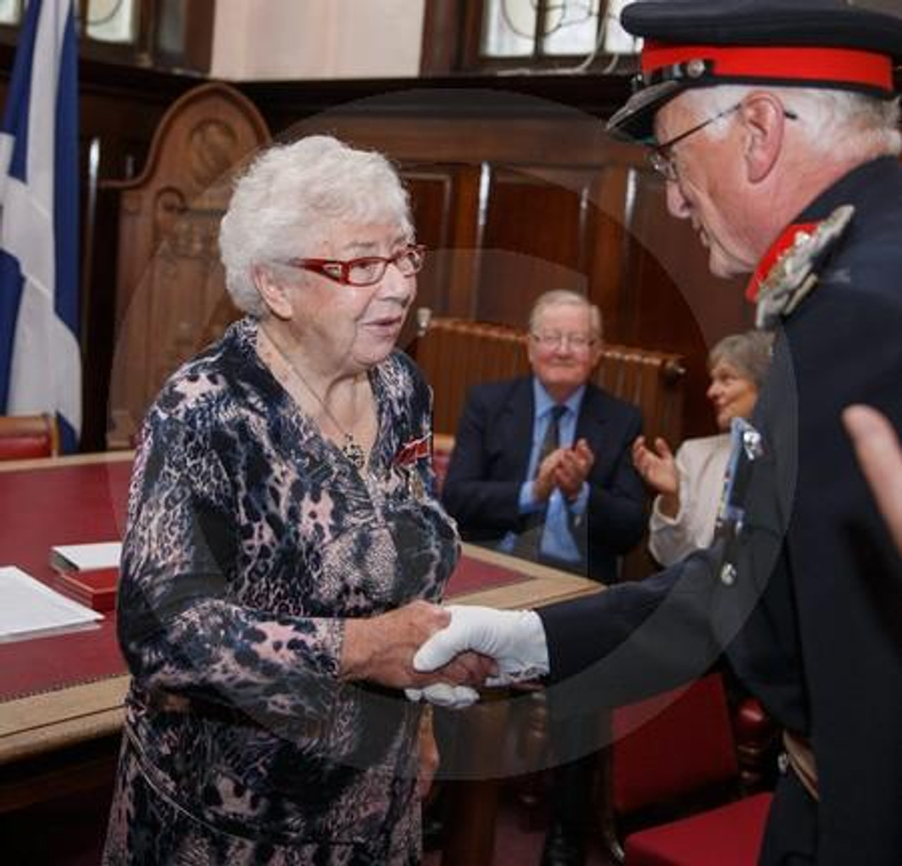 25783552 Beatrice Robertson Helensburgh presented with the British Empire Medal from Lord Lieutenant Rear Admiral Michael Gregory OBE