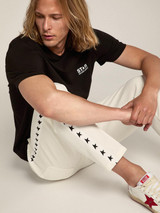 Golden Goose - T-shirt nera Collezione Star con logo e stella bianca a contrasto