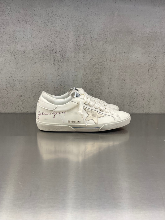 Golden Goose - Super-Star uomo in pelle bianca con stella platino e talloncino bianco