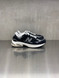 New Balance - U2010892NERO - Nera con dettagli grigio scuri e suola bianca