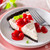 Cheesecake covered in cherries.