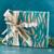 Wrapped Tastefully Simple gift box with decorative ribbon and bow.