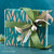 Wrapped Tastefully Simple gift box with green decorative ribbon and bow.