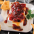 Bacon Pepper Jam spread over a block of cream cheese.