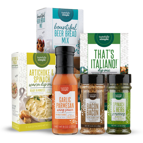 Tastefully Simple products, including Bountiful Beer Bread Mix®, Artichoke & Spinach Warm Dip Mix, That’s Italiano!™ Dip Mix, Garlic Parmesan Wing Sauce, Bacon Bacon™ and Spinach & Herb Seasoning.
