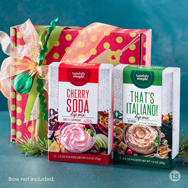 Tastefully Simple Cherry Soda Dip Mix and That's Italiano! Dip Mix displayed in front of a wrapped gift box.