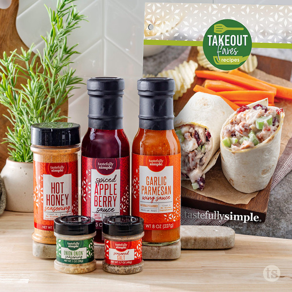 Tastefully Simple Hot Honey Seasoning, Spiced Apple Berry Sauce, Garlic Parmesan Wing Sauce, Onion Onion™ Seasoning, Seasoned Salt, and Takeout Faves recipe booklet.