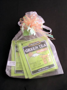 Fancy Herbal Tea Assortment in a bag wrapped w/Fancy Ribbon & Flowers Fancy Herbal Tea Assortment in a bag wrapped w/Fancy Ribbon & Flowers