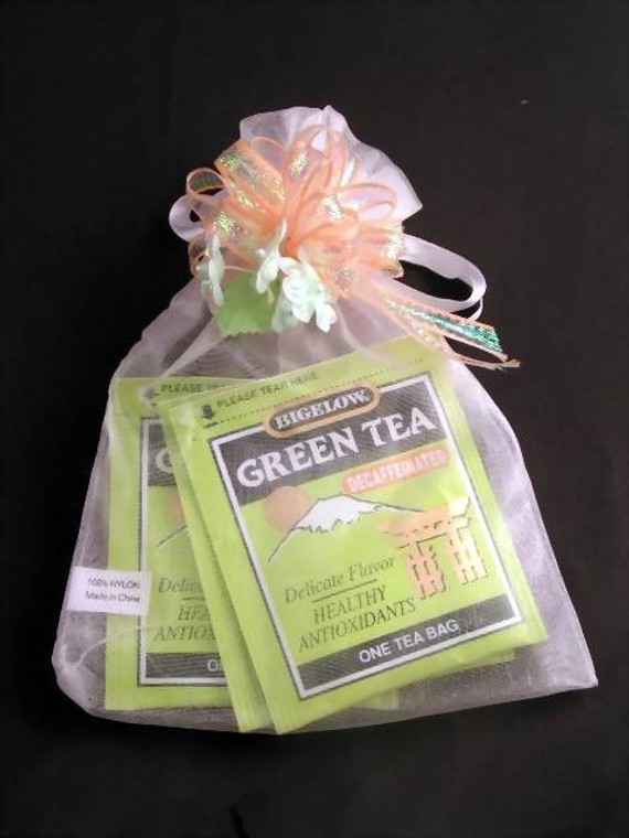 Fancy Herbal Tea Assortment in a bag wrapped w/Fancy Ribbon & Flowers