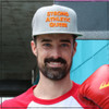 This is the Strong Athletic Queer Hat in Heather Grey with Orange Letters. People in the LGBTQIA Community have traditionally been told to blend in. Some people are happy for us to be our true selves and others want us to hide it for their own comfort. At Strong Athletic we know that being "out" is human right, but it is also a privilege, depending on the country that you are in and the circumstances of your life. That all being said, we've created this hat for the people who want to speak up and also for the people who can't. For those who can, wear these words proudly. For those who can't, we'll wear them for you and stand up for you until circumstances in your life change and you can proudly show people who you are no matter where you are. This Yupoong snapback hat is made at a Flexfit Facility, which is accredited by WARP Corp. These hats are crafted to last, and hat is why Yupoong hats are so popular. Strong Athletic guarantees that the stitching on your hat will not unravel and that the embroidery will last. If there is a production related issue with your hat- one that happened because the hat company made a mistake, get in touch and we’ll let you know about how replacement policy. Need to wash your snapback hat? Follow the instructions in the “about” section.  A portion of the profits from this hat was donated in advance to the nonprofit Pull for Pride, which supports LGBTQIA2S+ athletes in sports and power lifting. 