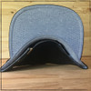 This is the bottom of the Strong Athletic 5-panel cap. The color of the bill is light blue, which goes nicely with the black cap. The black strap is made from 100% vegan leather. The hat folds easily, so you can throw it in your bag when you're wearing your skating helmet, and then pull it out and it's ready to wear right away. 