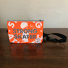This is the Strong Skater Fanny Pack made by Strong Athletic in collaboration with Flat Track Revolutions. This bum bag is neon orange with shiny silver ink. The fabric on the bag is waterproof. #strongathletic , #strongathletiskater , #rollerderby , #rollerderbyskater , #rollerderbyathlete 