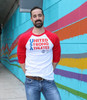 Front of the United Strong Athletes baseball t-shirt. This is a gender neutral Bella and Canvas shirt. The sleeves end right below the elbow. The shirt is white and the ink is red and blue. 50 % of the profits gets donated to USA Roller Derby Use the tag #unitedstrongathletes when tagging us.