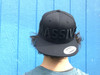 This is a front view of the Massive Black on Black Snapback Hat by Strong Athletic. We love the word massive. We think that it means you're doing things. You're doing positive with your life. That you're big! You're strong! We think that people who tell you that your body should look a certain way are wrong. Only you determine what your body should look like and how it's described. Be Massive! Take up Space! 