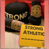 Every time we send out a Strong Athletic product we make sure to wrap it in a wrap that reads, “You are so Strong”, and we seal the wrap with one of our signature Strong Athletic stickers. We also include a postcard that tells you our origin story on one side, and that has our Strong Athletic ____________ art on the other side. We always hope that you’ll write in what ever third word is the most meaningful to you on that post card. We always send a few stickers, including any that you choose to add to your order. All of our stickers, including the ones that we send with your shirt, are produced in the US by small-scale sticker company. We’re a company that doesn’t believe in mass buying or mass production. This means that when we order something online, we want the experience to be special and unique. We assume the same is true for people buying products from our site. It’s for this reason we put so much care into packaging and sending your Strong Athletic item. If this is a gift, you can even include instructions for a hand written note that we will include with the package. We hope you enjoy! And if you do, we hope you consider writing us a review about your product. 