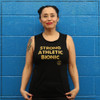 This is the front of the Strong Athletic Bionic Muscle Tank, printed on a solid black Bella Canvas Flowy Muscle Tank, 8803. The words are printed in gold ink on the front. The arm holes of this tank are cut to be low enough to see a bit of your bra, but not so much. This tank is probably the most popular style of tank that Strong Athletic has. 