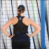 This is the back view of the Strong Athletic Woman Black Performance Racerback Wicking Tank Black with White Ink.  People love this racerback top because the fabric is super light weight, plus it moves with your body. This shirt is made by Strong Athletic the queer owned, woman run t-shirt company that believes in the power of athletes speaking up for what they believe in. Strong Athletic made the Strong Athletic Woman design because we know that so many women identify as strong women, yet they are often times told to stand down, be nice, apologize for their strength and to demand less than men demand in sports. We want to change that. 