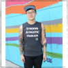 This is the front of the Strong Athletic Human Crew Neck Muscle Tank Grey with White Ink. Do you know any strong humans? we know a ton and we love that they want to proudly wear these words across their chest. 

This tee is made by Bella Canvas, which means that the quality is very high and that it's been made in a W.A.R.P Certified facility.  The style number is Bella 3483.