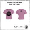 This is the shiraz purple Strong Athletic Mom Crop Top T-shirt by mom owned company Strong Athletic. The front of the shirt has the words Strong Athletic Mom printed within in a black circle with distressed ink. The Strong Athletic logo is also printed on the front of the shirt. 