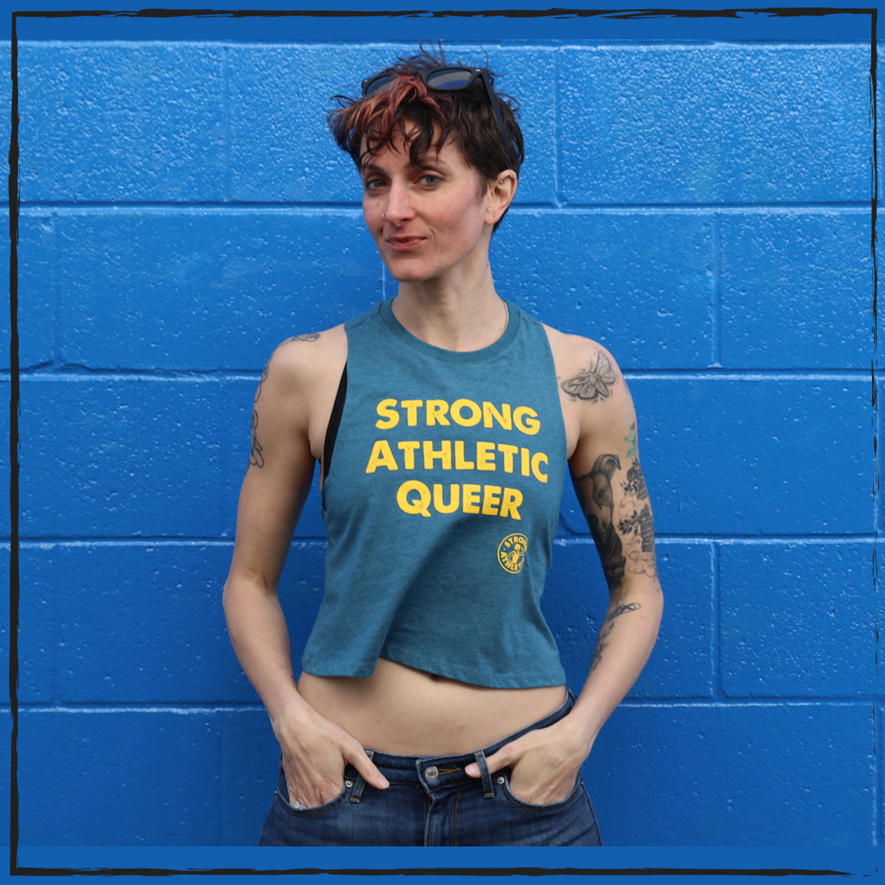 https://cdn11.bigcommerce.com/s-5nhnnhhl3t/images/stencil/1280x1280/products/315/3845/Strong-Athletic-Queer-Blue-Crop-Top-with-Yellow-Ink-Front-View-Rasta__90549.1670706570.jpg?c=2