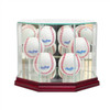 6 baseballs in display case with glass and cherry wood base