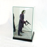 Joker miniature inside figurine display box with black wooden base facing right