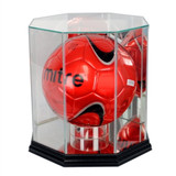 red soccer ball in a glass display case with a black base side view