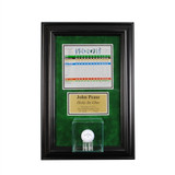 hole in one display with a golf ball and scorecard over green backing with black frame
