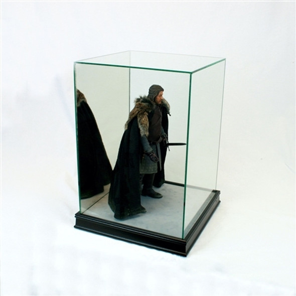 Game of Thrones figurine with sword in a mini figurine display case made of glass with a black base facing right