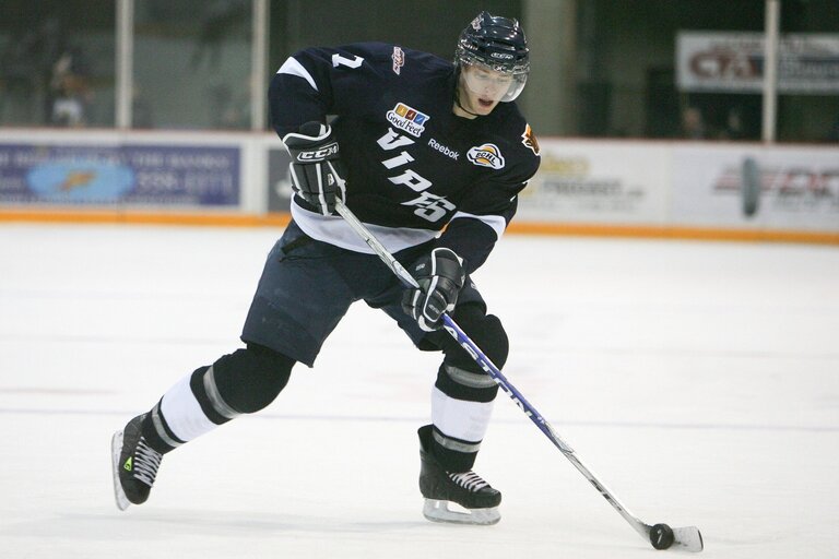 photo of a male athlete playing hockey