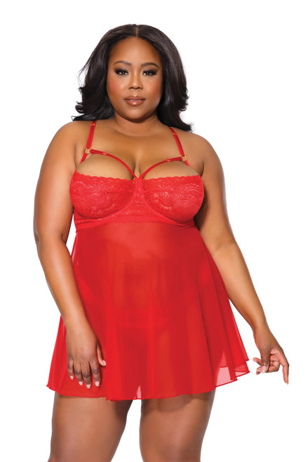 Plus size lingerie model wearing a red underwired harness cup babydoll with sheer skirt and matching thong.