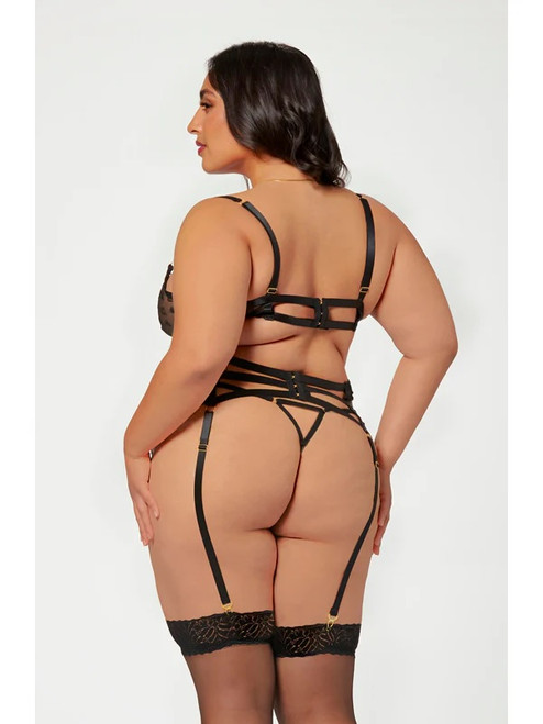 Plus  size lingerie model show in the rear of aa black lace bra and garter set featuring  an underwire love heart lace cups with scalloped lace trim, double strap back detail with adjustable hook n'eye closure, a black love heart lace garter belt with flexible front boning, stretch triple strap rear detail with hook n'eye closure and matching, black multi strap g-string.