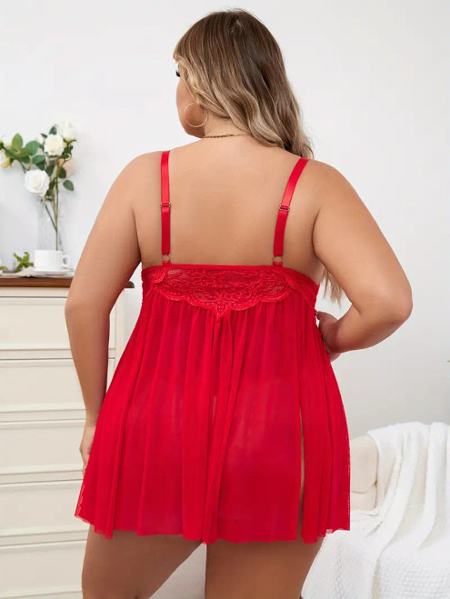 Plus size sheer red babydoll set featuring soft cups with lace overlay, red harness style over-bust straps, red satin bow detail, adjustable straps , red stretch lace under-bust band, a flowing sheer skirt with spilts on either side and matching red G-String. Plus size sheer red babydoll set featuring soft cups with lace overlay, red harness style over-bust straps, red satin bow detail, adjustable straps , red stretch lace under-bust band, a flowing sheer skirt with spilts on either side and matching red G-String.