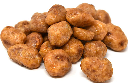 A pile of candied peanuts coated in a crunchy, caramelized brown sugar shell, displayed on a white background. The peanuts have a rough, textured appearance and a sweet, golden-brown glaze.