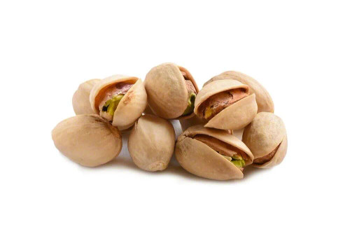 A small pile of roasted pistachios in their shells, displayed on a white background. The shells are partially open, revealing the greenish-brown pistachio nuts inside. The texture appears dry and slightly rough, typical of lightly salted or roasted pistachios.