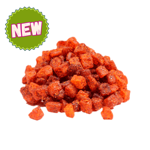 Pile of diced dried pineapple chunks coated in chamoy seasoning, vibrant red-orange color with a sweet, tangy, and mildly spicy flavor — Chamoy pineapple Mexican-style fruit snack.