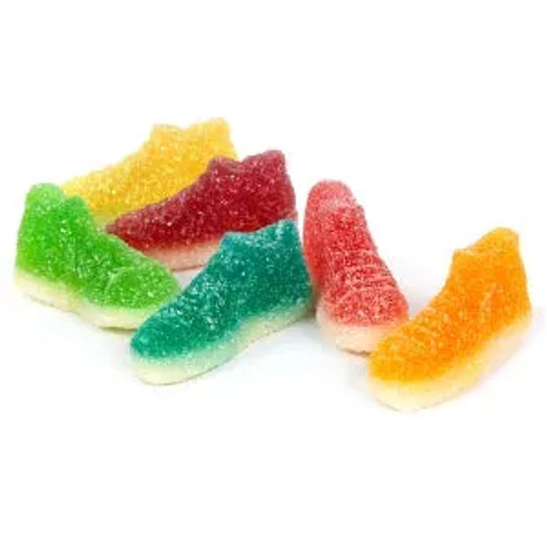 A group of colorful gummy candies shaped like high-top sneakers, displayed on a white background. The gummies come in bright colors like red, green, yellow, orange, and blue, and are coated with a layer of sour sugar crystals, giving them a fun, playful, and tangy appearance.