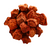A pile of dried seedless plums coated in li hing powder, displayed on a white background. The plums have a deep reddish-brown color with a rough, textured surface and are generously dusted with the tangy-sweet li hing seasoning.