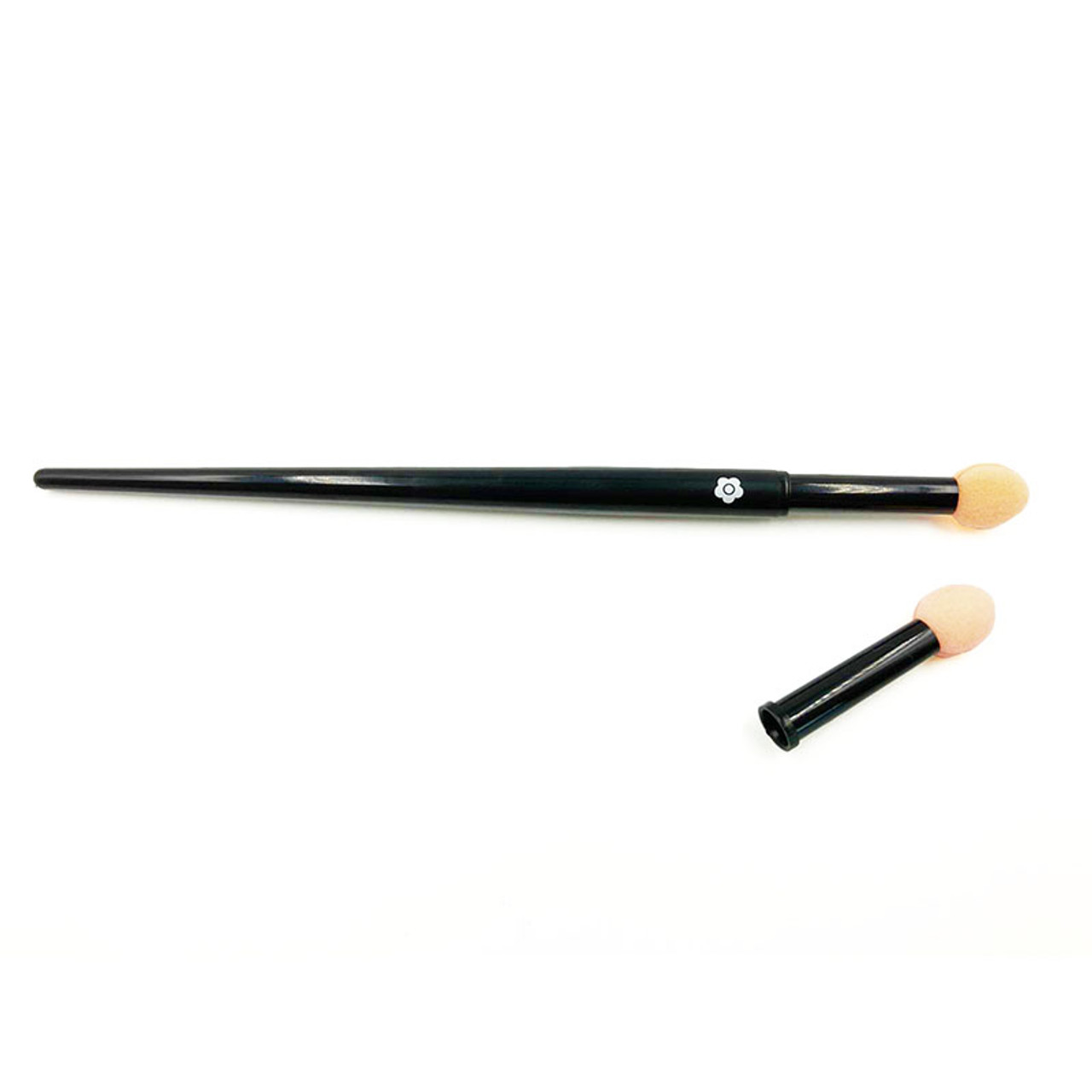The Eyebrow Tip is pictured, it has a sponge applicator and a long black handle with the Mary Quant Daisy printed on it. It comes with a spare applicator tip which is also pictured.